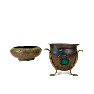 Lot 34 - An Arts and Crafts copper bowl by Dryad with rope twist rim and plaited foot to the base.