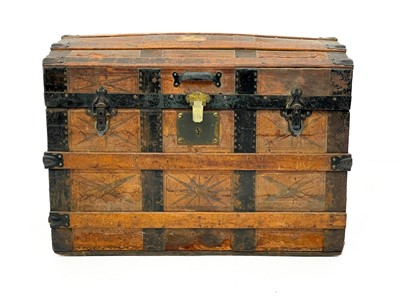 Lot 1863 - An oak and iron banded domed top trunk.