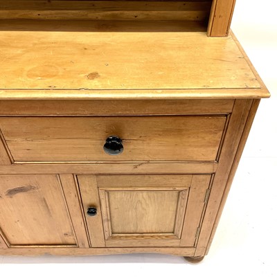 Lot 130 - A Victorian pine kitchen dresser.