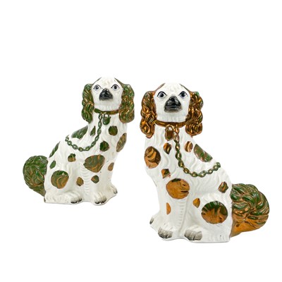 Lot 877 - A pair of Victorian green and copper lustre spaniels.