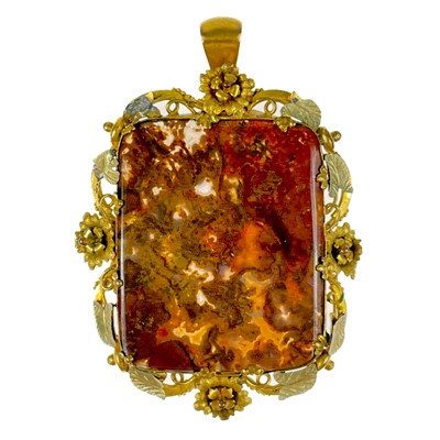 Lot 154 - An early 19th century pinchbeck mounted moss agate large pendant.