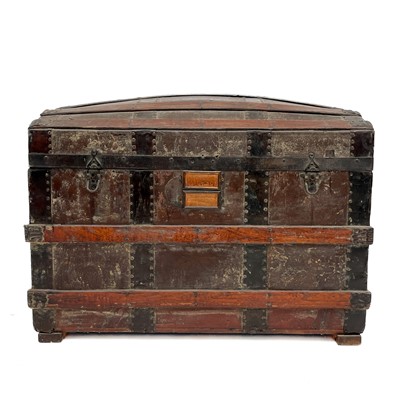 Lot 1950 - A Victorian slatted metal bound domed topped trunk.