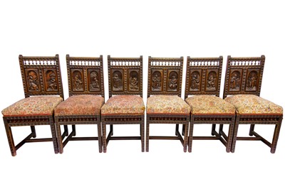 Lot 143 - A set of six Continental oak dining chairs.