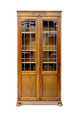 Lot 1849 - An early 20th century oak bookcase.