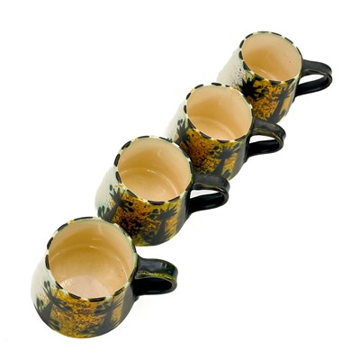 Lot 812 - A Newlyn Celtic pottery coffee service in the folk pattern.