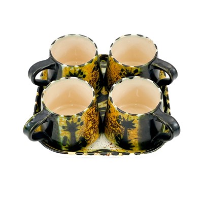Lot 812 - A Newlyn Celtic pottery coffee service in the folk pattern.