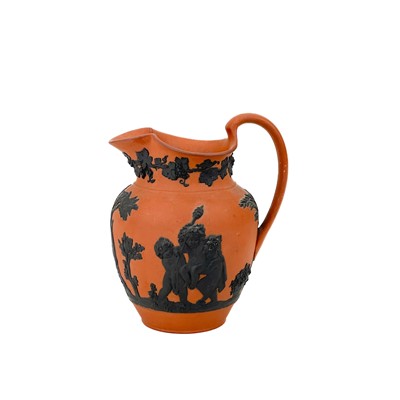 Lot 864 - A Wedgwood Rosso Antico jug.