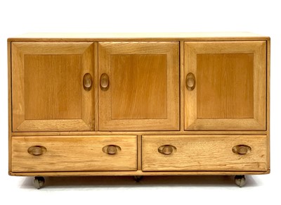 Lot 1816 - An Ercol Windsor light elm sideboard.