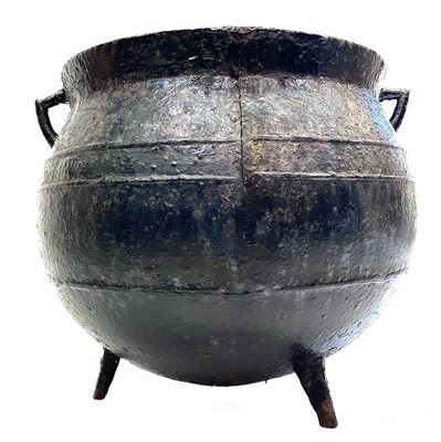 Lot 126 - A Victorian cast iron large twin handled cauldron.