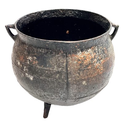 Lot 126 - A Victorian cast iron large twin handled cauldron.