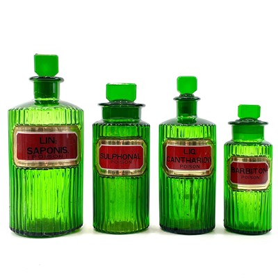 Lot 178 - Four green glass apothecary jars and stoppers.