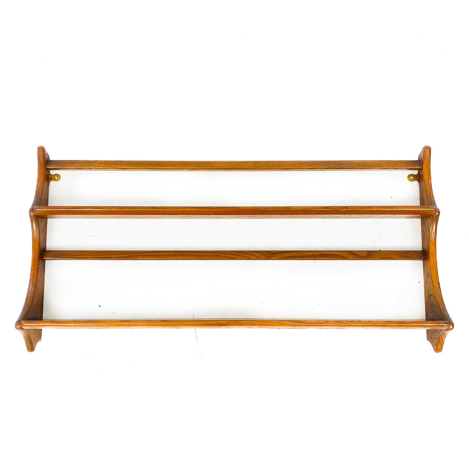 Lot 1827 - An Ercol elm wall hanging plate rack.