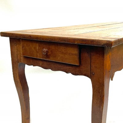 Lot 35 - A French fruitwood farmhouse kitchen table.