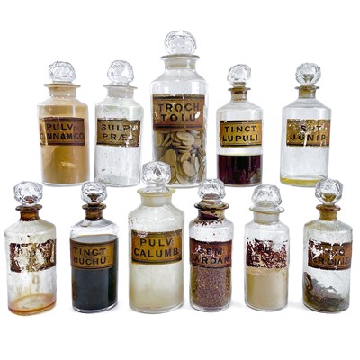 Lot 183 - A collection of glass apothecary bottles and stoppers.