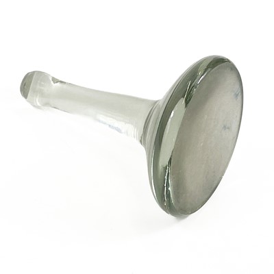 Lot 910 - A glass muller, with a ground base, and a pestle and mortar.