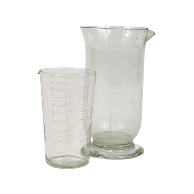 Lot 910 - A glass muller, with a ground base, and a pestle and mortar.