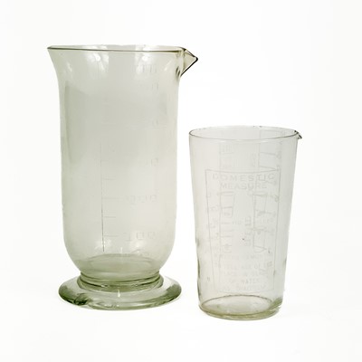 Lot 910 - A glass muller, with a ground base, and a pestle and mortar.