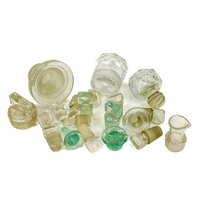 Lot 910 - A glass muller, with a ground base, and a pestle and mortar.