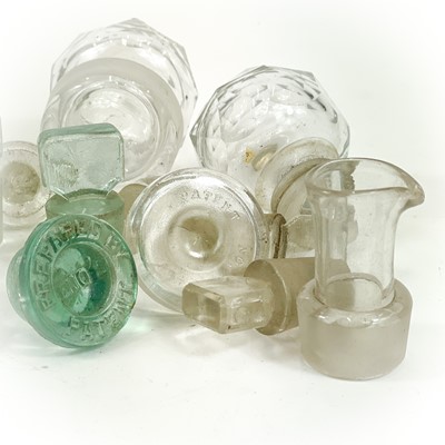 Lot 910 - A glass muller, with a ground base, and a pestle and mortar.