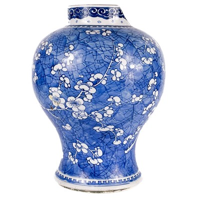 Lot 566 - A Chinese blue and white porcelain prunus pattern baluster vase, 18th/19th century.