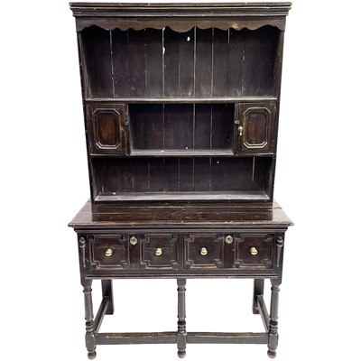 Lot 125 - An 18th century style oak dresser.