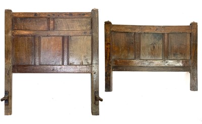 Lot 211 - An 18th century panelled oak bedhead and end.