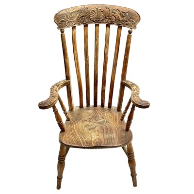 Lot 215 - An early 20th century ash and elm Windsor armchair.