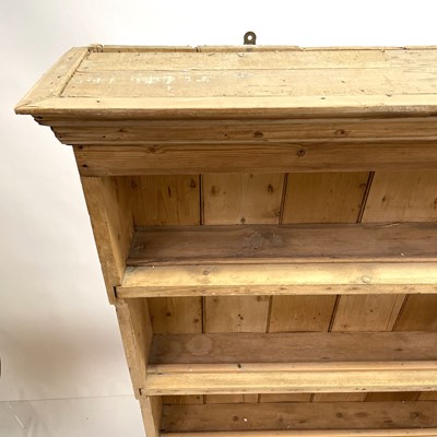 Lot 217 - A 19th century pine dresser plate rack.