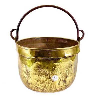 Lot 221 - A large 19th century brass cauldron with wrought iron handle.