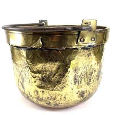 Lot 221 - A large 19th century brass cauldron with wrought iron handle.