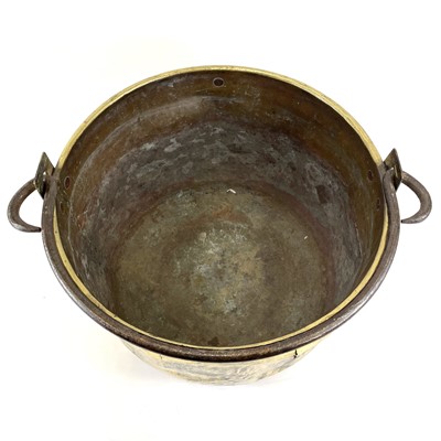 Lot 221 - A large 19th century brass cauldron with wrought iron handle.