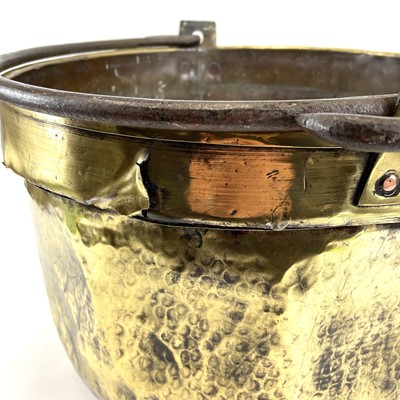 Lot 221 - A large 19th century brass cauldron with wrought iron handle.