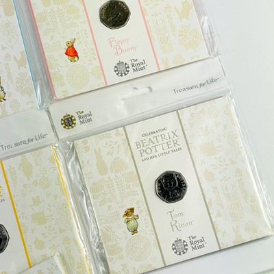 Lot 42 - UK 50 pence Uncirculated Beatrix Potter coins in Royal Mint packaging (x11)