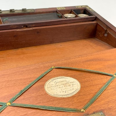 Lot 67 - A Georgian mahogany and brass bound campaign writing slope by Gaimes.