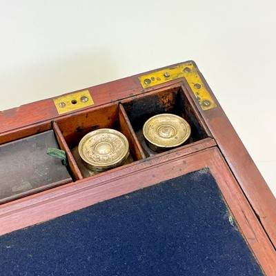 Lot 67 - A Georgian mahogany and brass bound campaign writing slope by Gaimes.