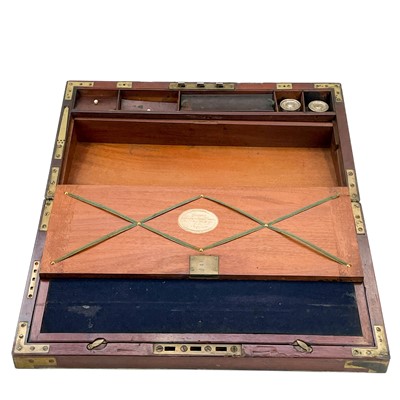 Lot 67 - A Georgian mahogany and brass bound campaign writing slope by Gaimes.