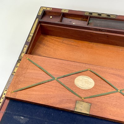Lot 67 - A Georgian mahogany and brass bound campaign writing slope by Gaimes.
