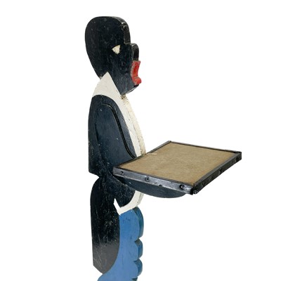 Lot 252 - An early 20th century painted wood figural dumb waiter.