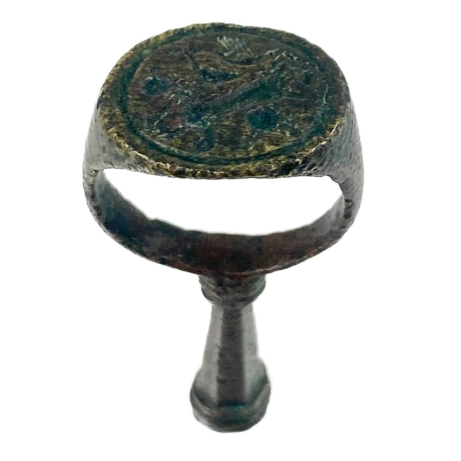 Lot 231 - A 17th century copper-alloy seal and pipe tamper ring.