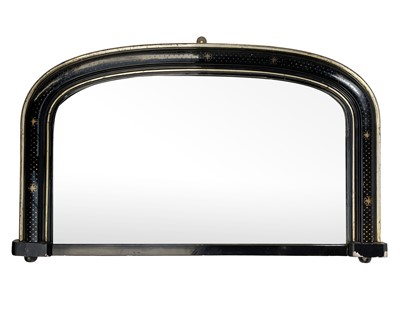 Lot 659 - A Victorian ebonised and gilt arched overmantel mirror.