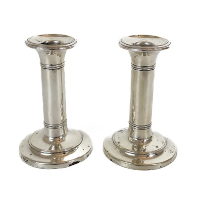 Lot 184 - A pair of Victorian silver candlestick holders by I S Greenberg & Co.