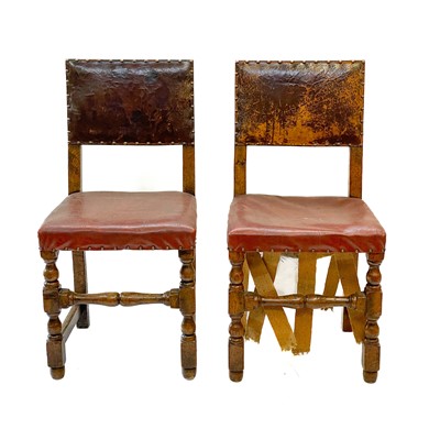 Lot 129 - A pair of oak and leather Cromwellian style chairs.