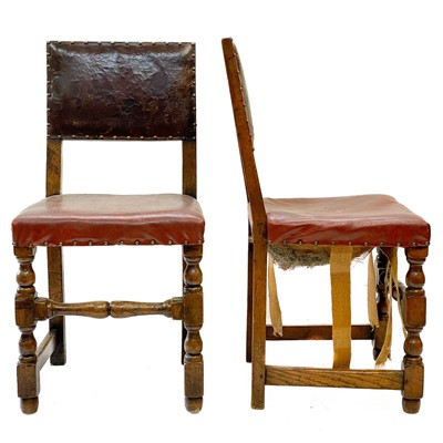 Lot 129 - A pair of oak and leather Cromwellian style chairs.