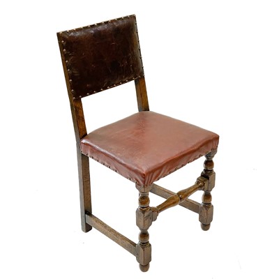 Lot 129 - A pair of oak and leather Cromwellian style chairs.