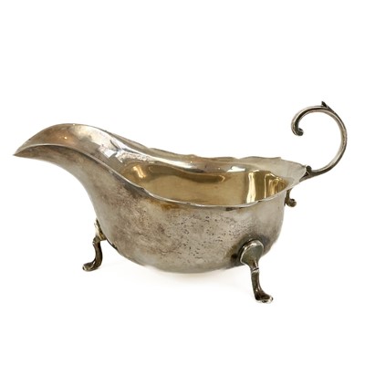 Lot 19 - A George V silver gravy boat by Barker Brothers.