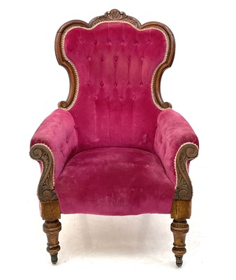 Lot 1842 - A Victorian walnut upholstered spoon back armchair.