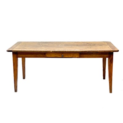 Lot 197 - A French farmhouse poplar and fruitwood dining table.