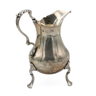 Lot 204 - A George V silver milk jug by Haseler Brothers