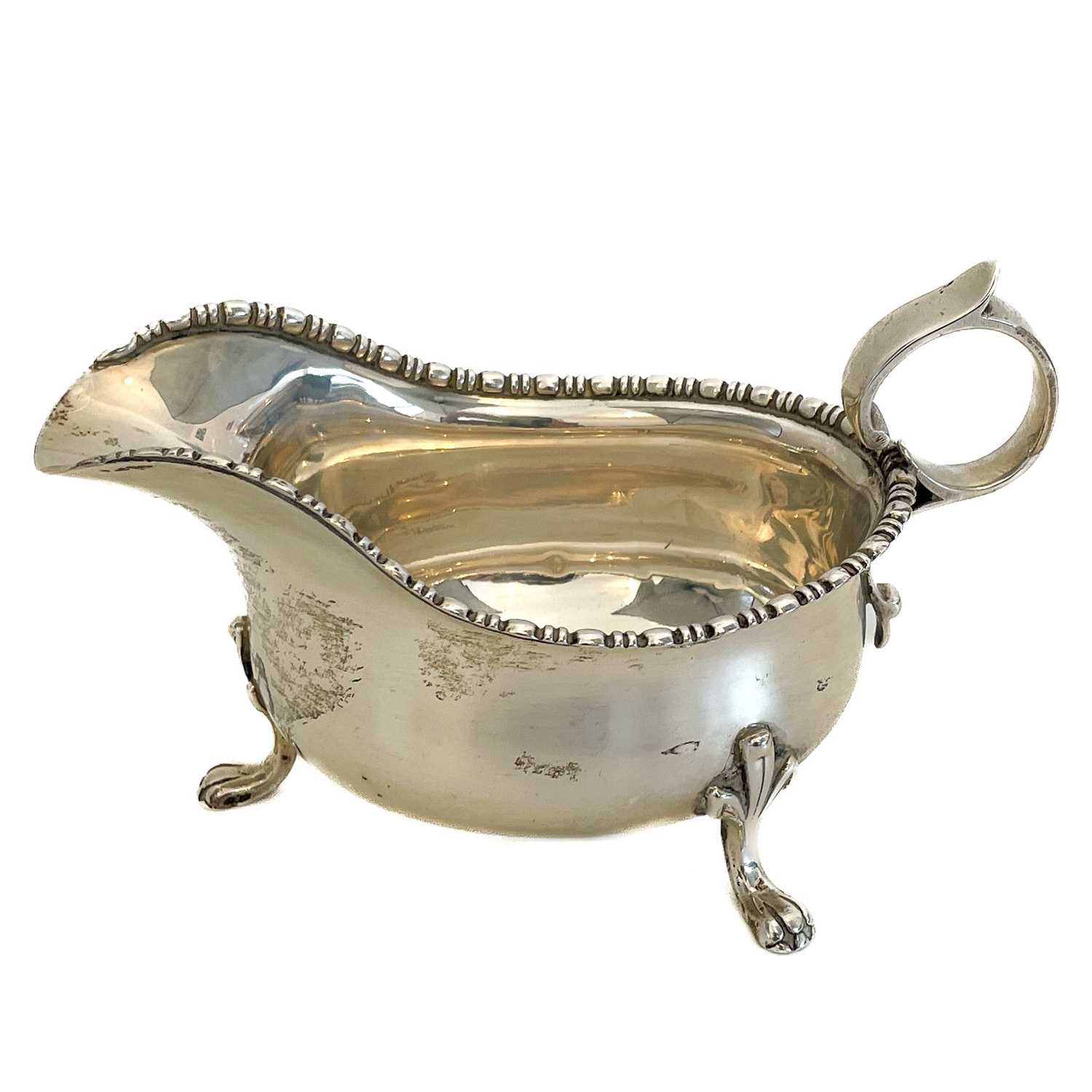 Lot 374 A V silver gravy boat by Cooper