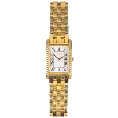 Lot 71 - A Bucherer 'Eximia' 18ct gold and diamond set lady's automatic bracelet wristwatch.